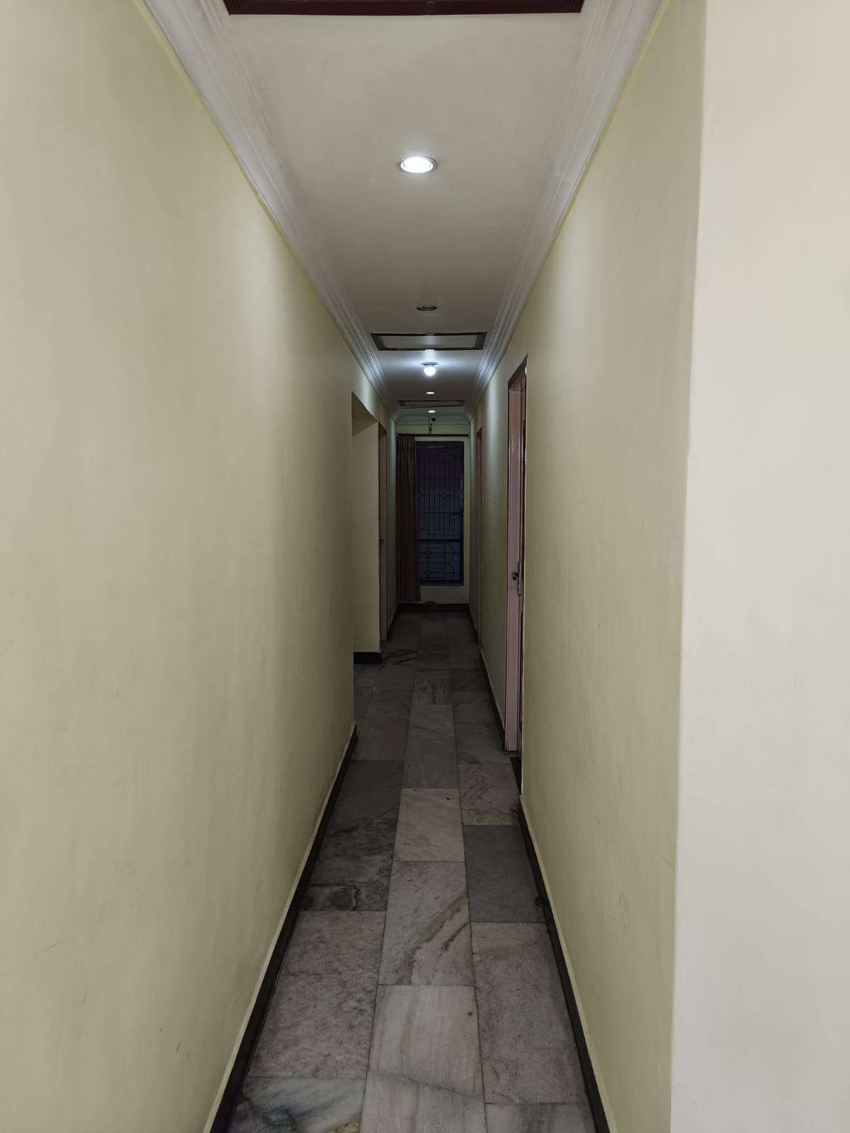 Well-lit guest corridor inside MRS Residency